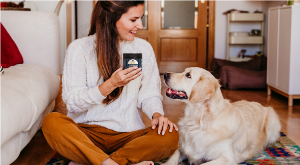 woman and dog, woman holding Gut Guard 