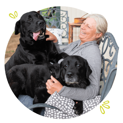 image of Dana and her dogs on her lap