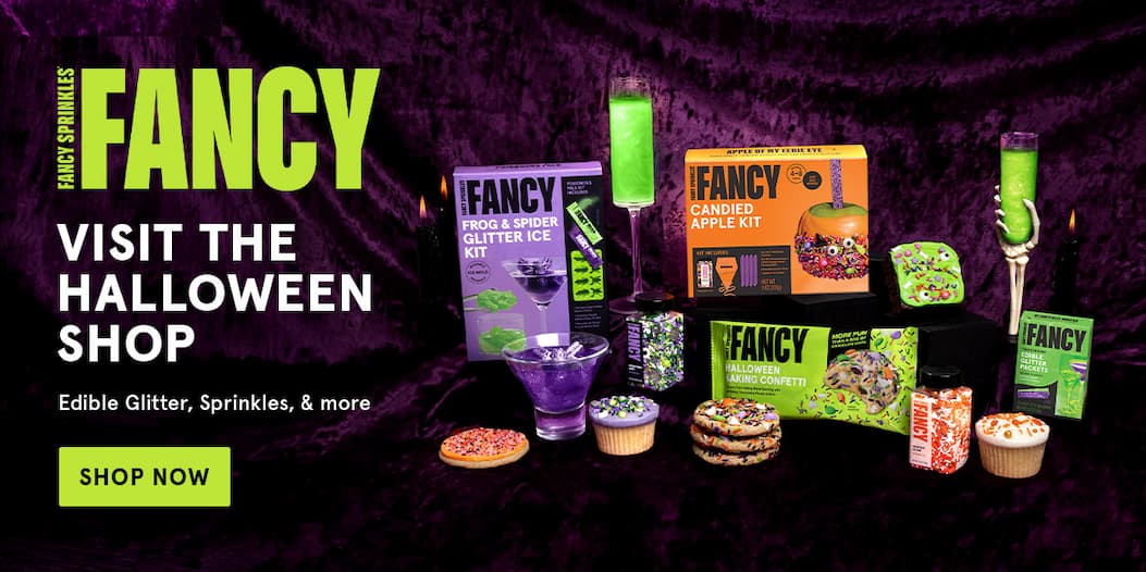 A moody photo showing a variety of Fancy's Halloween items, and the text invites you to Visit the Halloween Shop on Amazon. Click to shop now. 