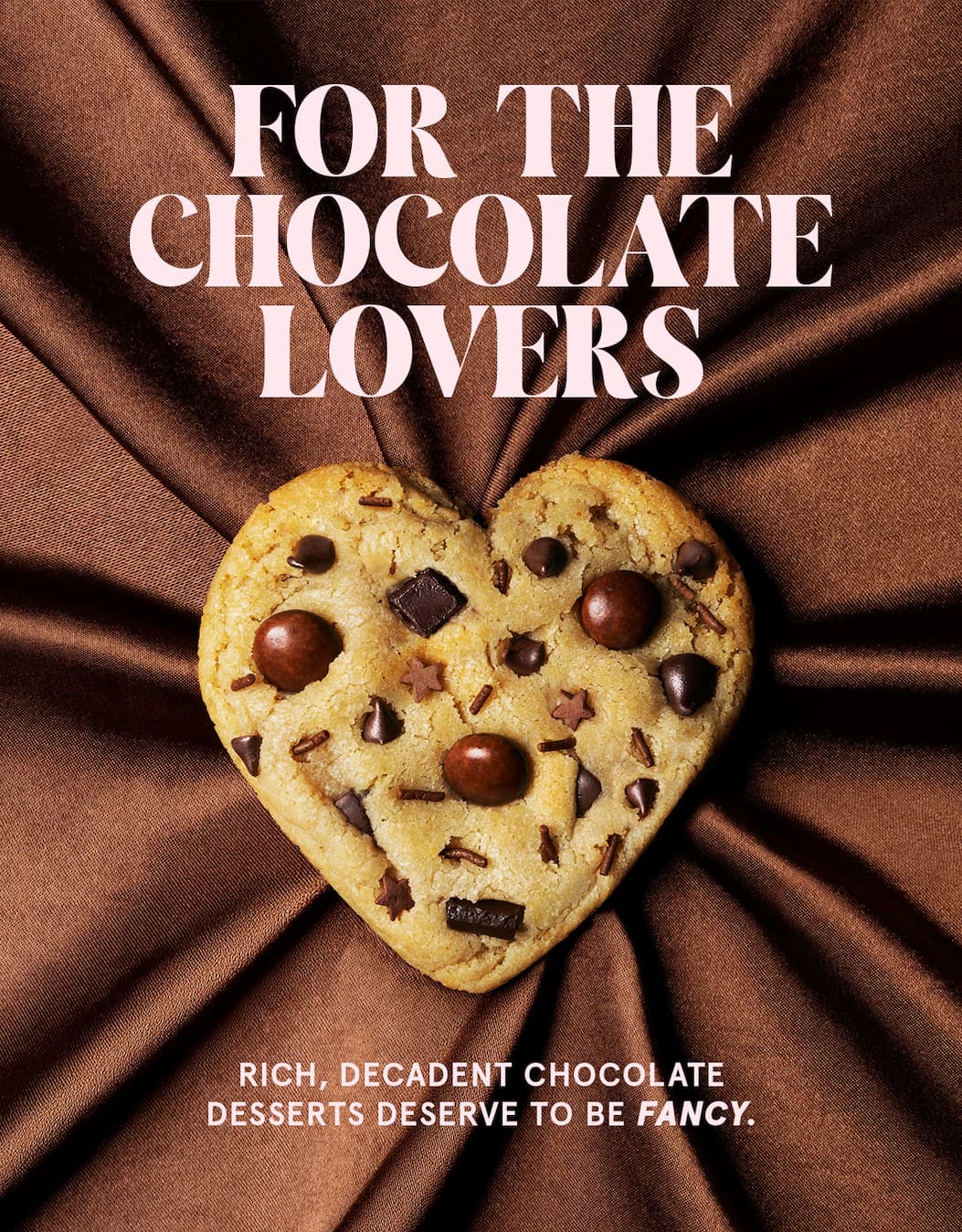 Headline: For the Chocolate Lovers above a chewy cookie baked with a variety of chocolatey pieces.