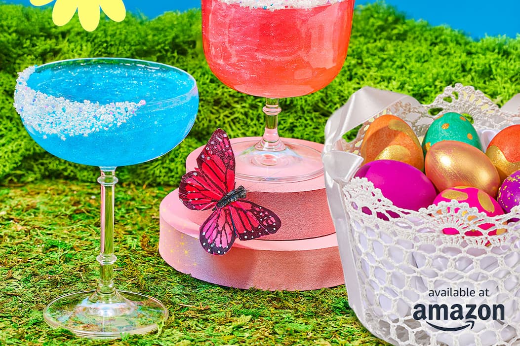 sparkly blue and red drinks, a butterfly, and a basket of easter eggs