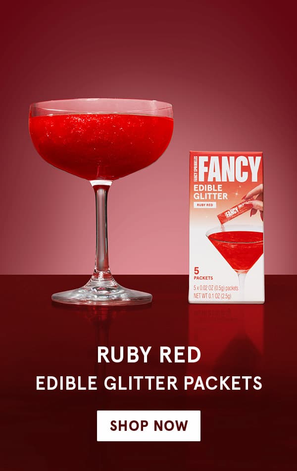 A cocktail glass decorated with our Ruby Red Edible Glitter, shop now!