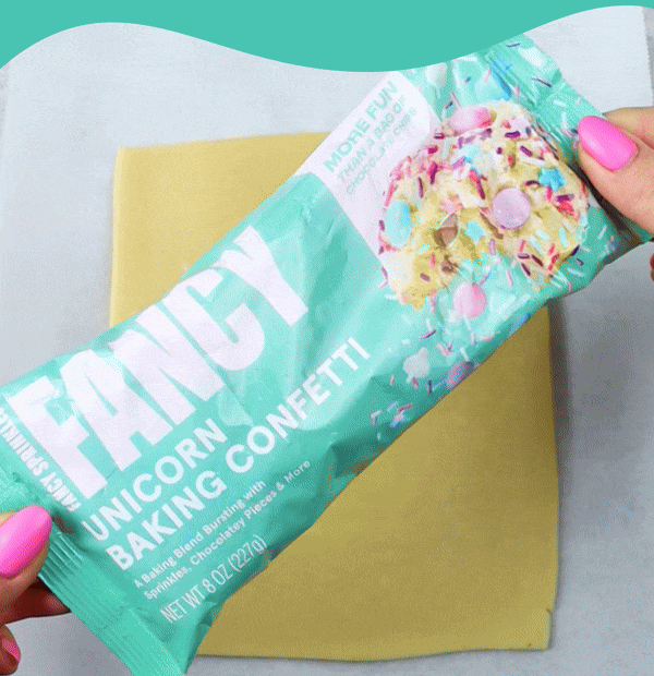 a gif showing flower shaped cookies baked with Fancy Baking Confetti in Unicorn