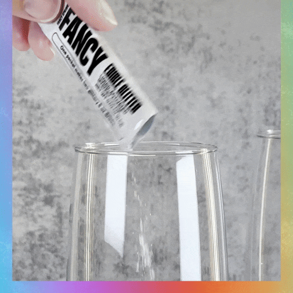 a gif of Fancy Edible glitter in mystery colors revealing a yellow and blue glittery surprise.