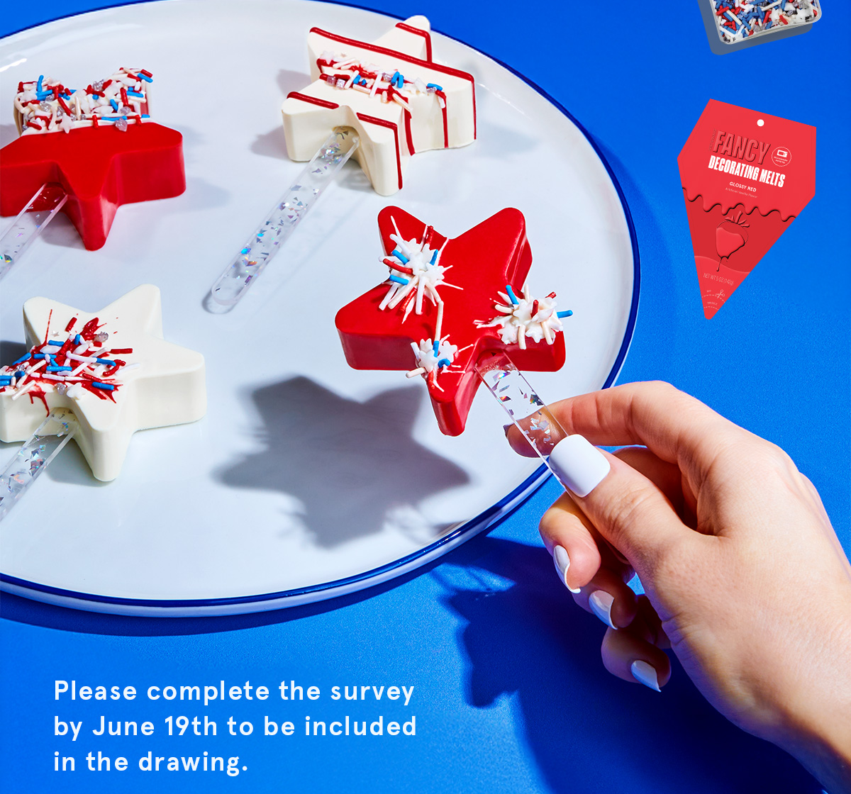 A hand holding a star shaped cake pop, and a notice to please complete the survey by June 19th to be included in the drawing.