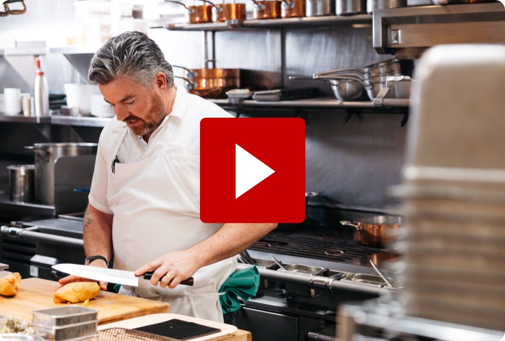 Chef Coulson Armstrong searing steak in the Prime Seafood Palace kitchen — play video