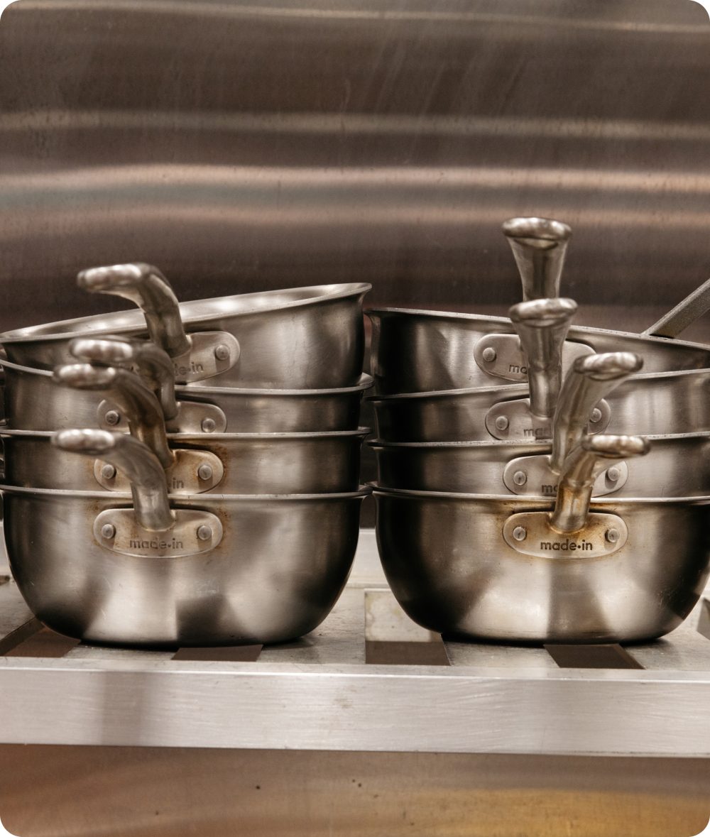 Stack of Made In stainless steel pots in the World Equestrian Center kitchen