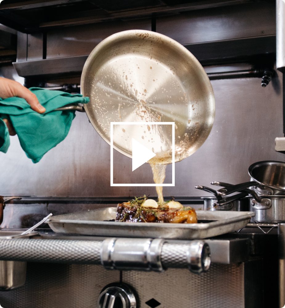 Pouring pan sauce over steak — play video