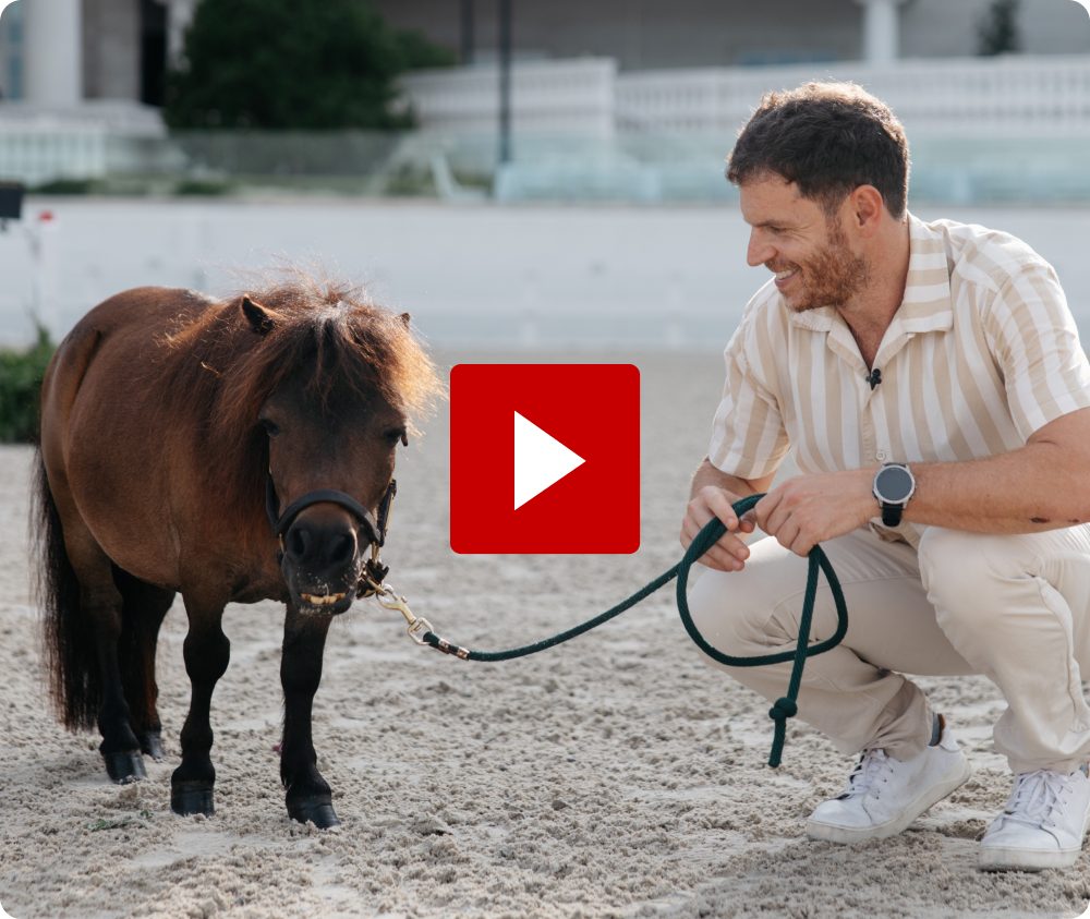 Made In Co-Founder Chip Malt with a dwarf horse at the World Equestrian Center, with a video play button