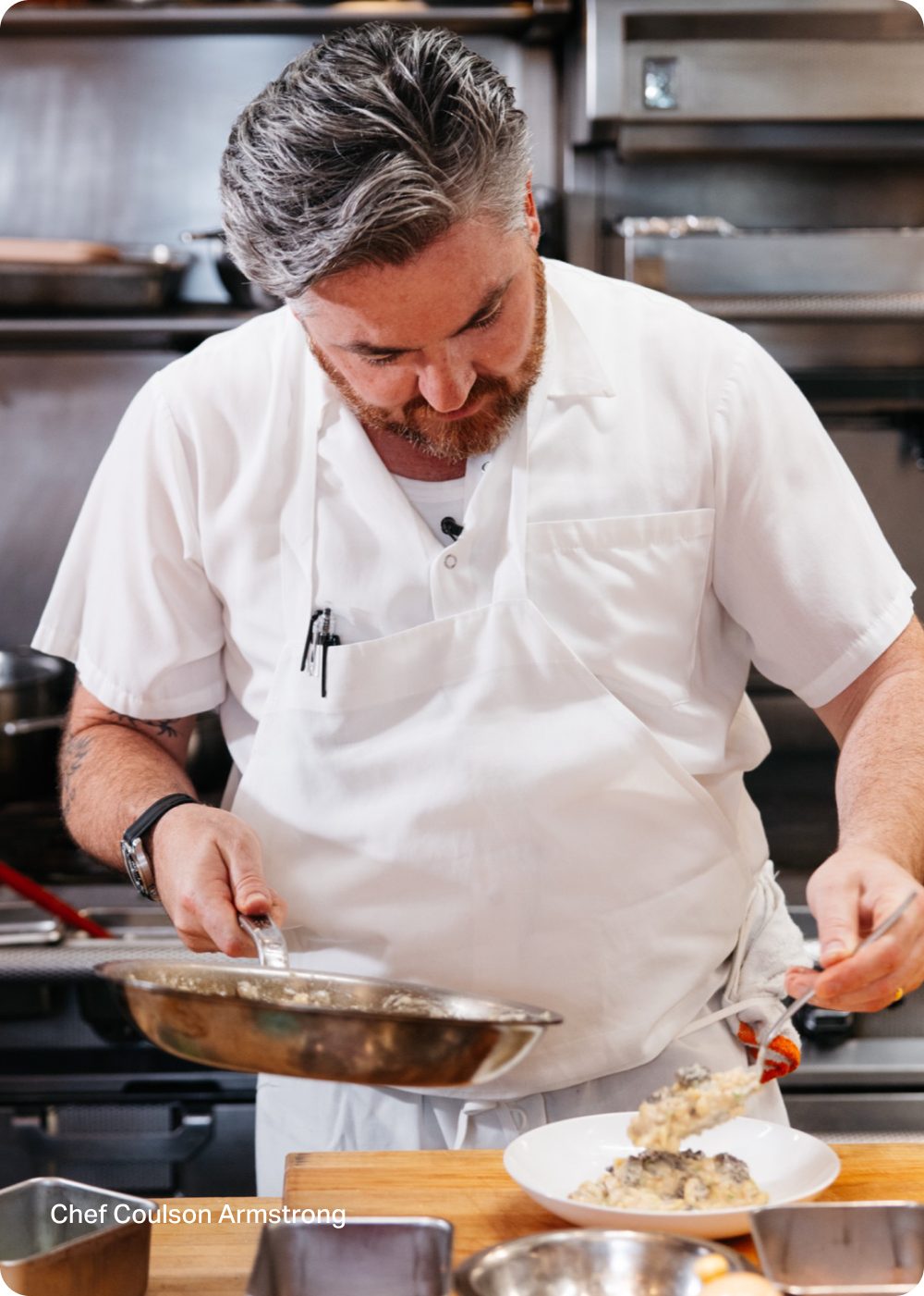 Chef Coulson Armstrong plating a dish in the kitchen