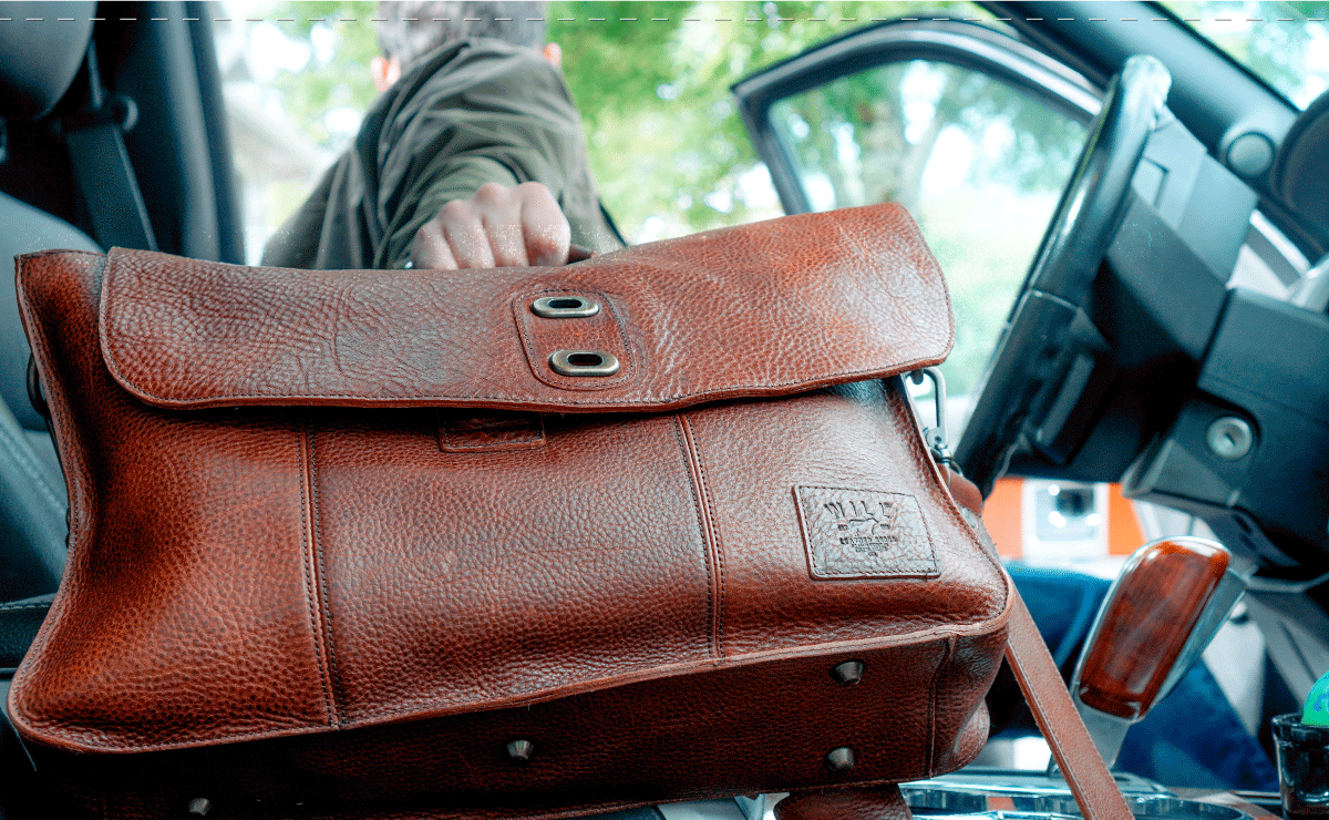 Leather work bag carried into a vehicle