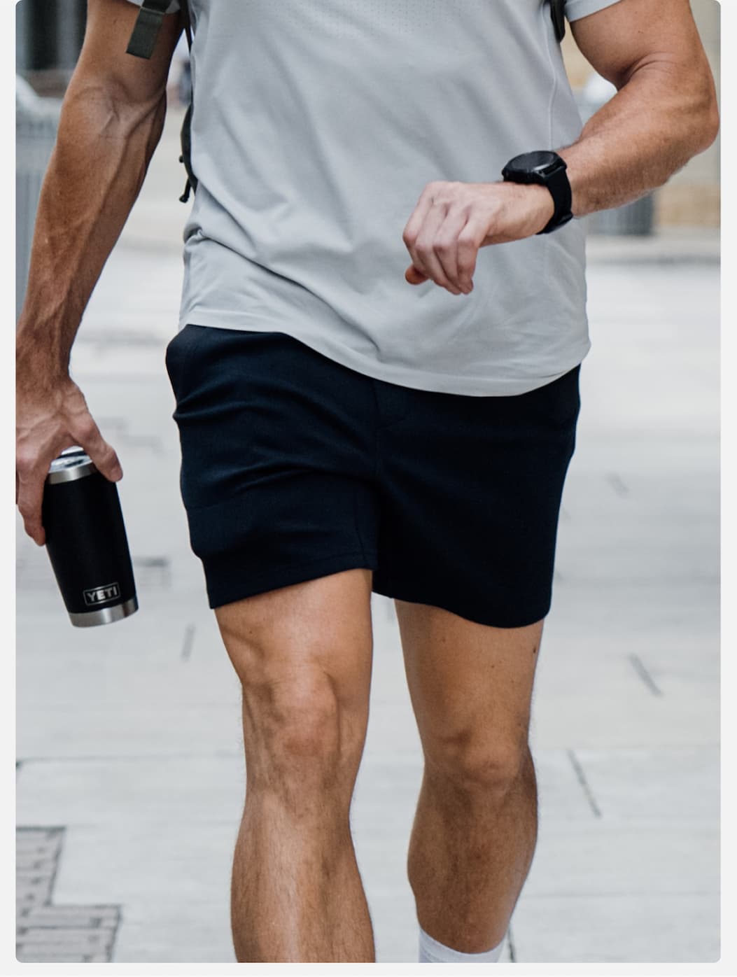 Lifestyle Image: Commuting in Black Recover Short