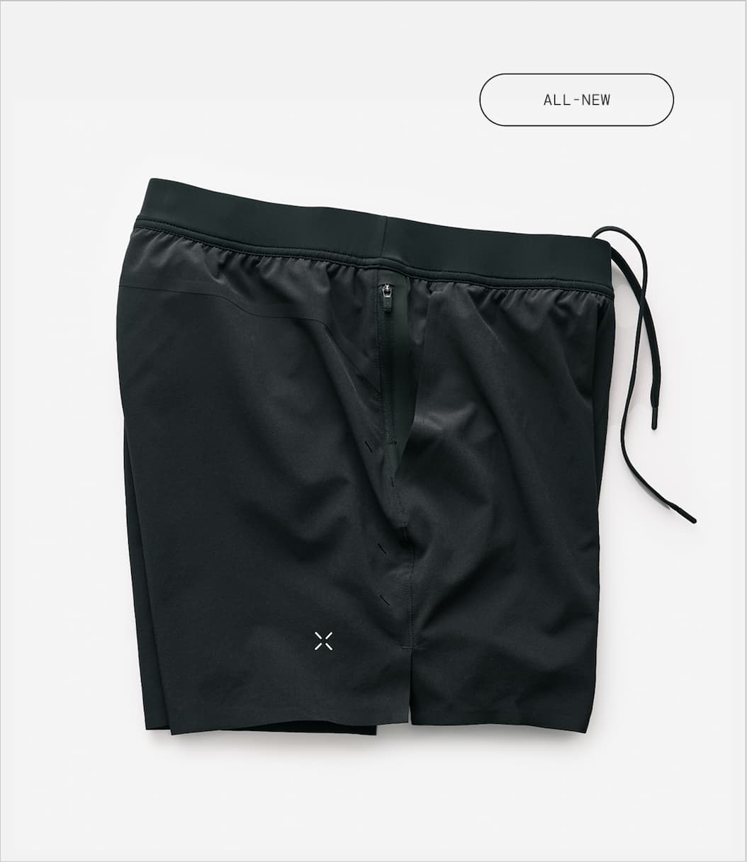 Stylized Laydown Image of Black Lined Interval Gym Short