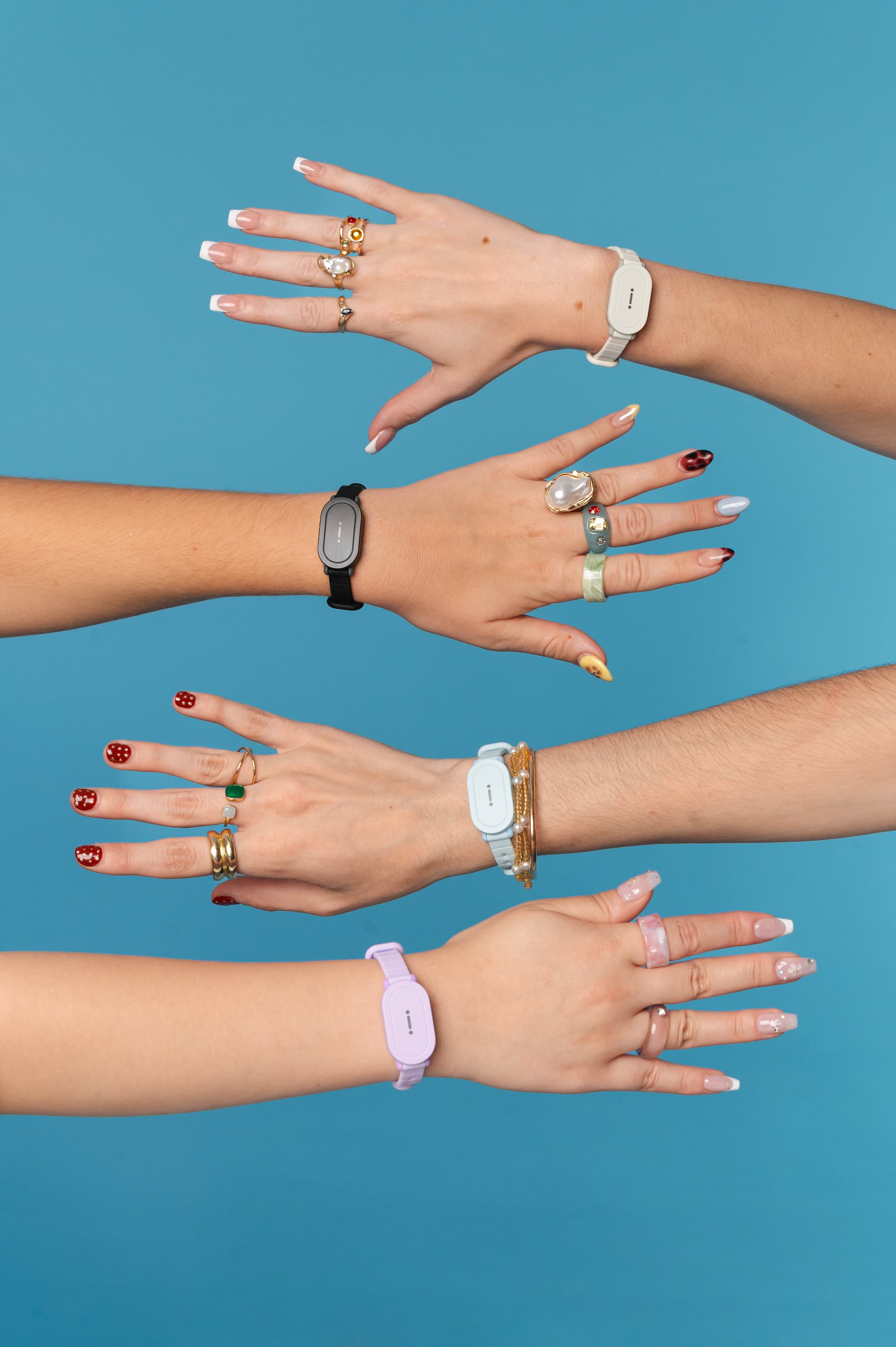 4 hands wearing the Bond Touch POP on a blue background