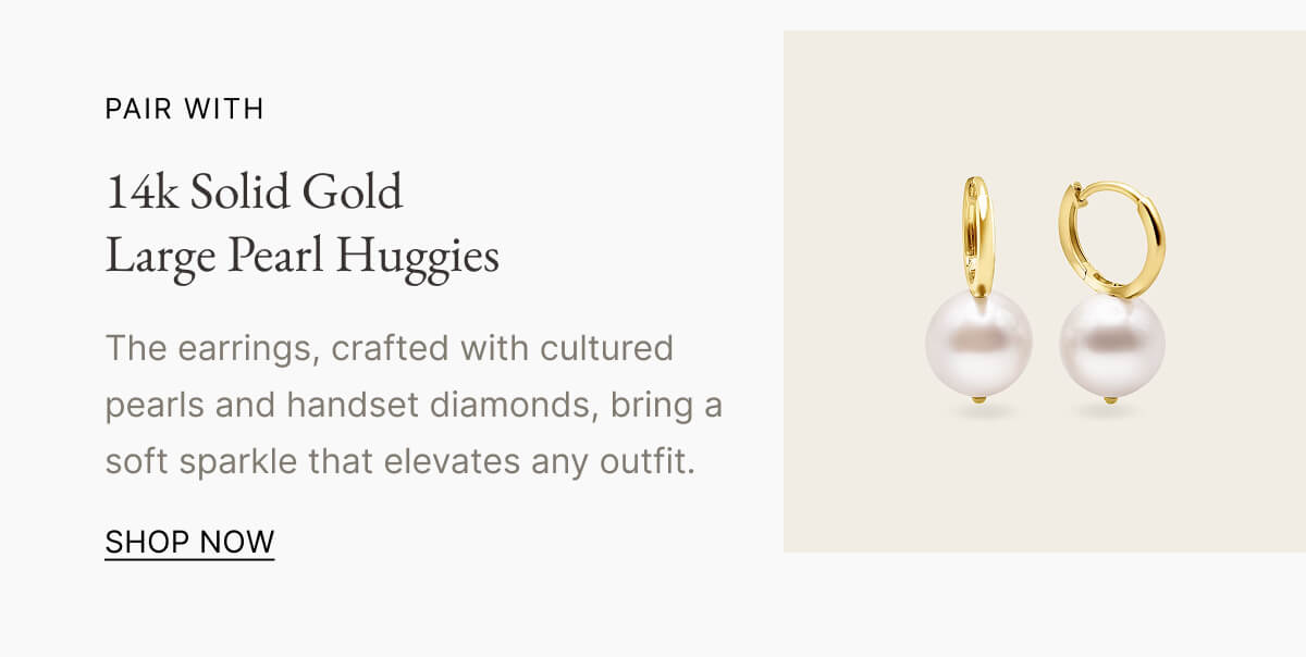 14k Solid Gold Large Pearl Huggies The earrings, crafted with cultured pearls and handset diamonds, bring a soft sparkle that elevates any outfit. SHOP NOW