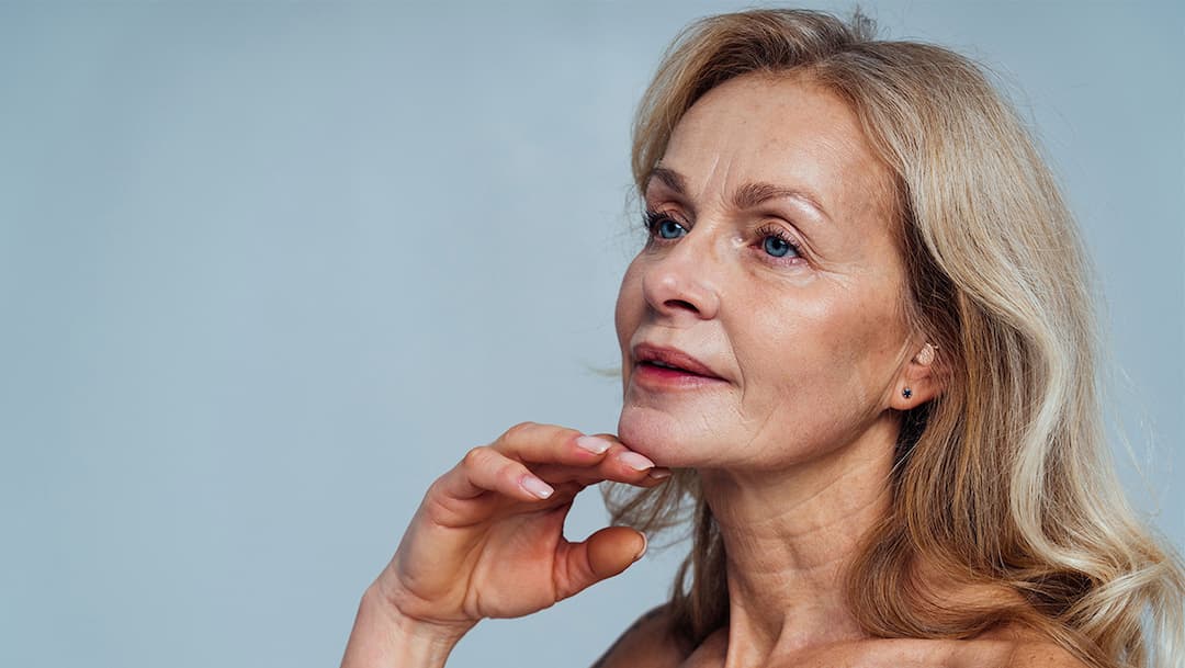 A woman wearing her Audien hearing aids