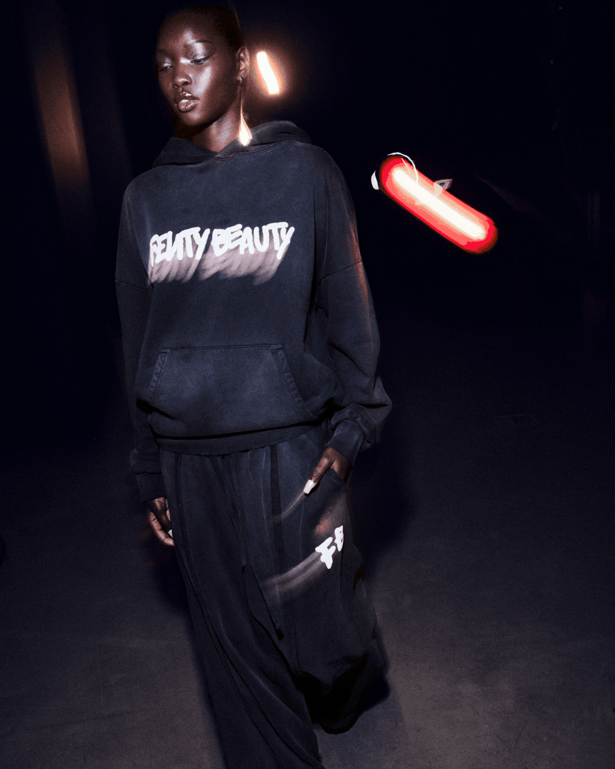 MODEL WEARING FENTY OVERSIZED HOODIE + SWEATPANTS