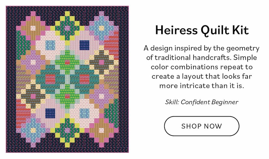 Image: A dark quilt with colorful geometric blocks. Text: Heiress Quilt Kit. A design inspired by the geometry of traditional handcrafts. Simple color combinations repeat to create a layout that looks far more intricate than it is. Skill. Confident Beginner. Shop Now >>