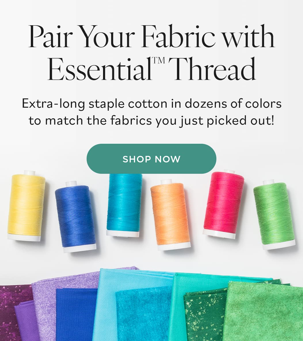 Image: Colorful spools of thread and matching cuts of quilting cotton fabric. Text: Pair Your Fabric with Essential Thread. Extra-long staple cotton in dozens of colors to match the fabrics you just picked out! Shop Now >>