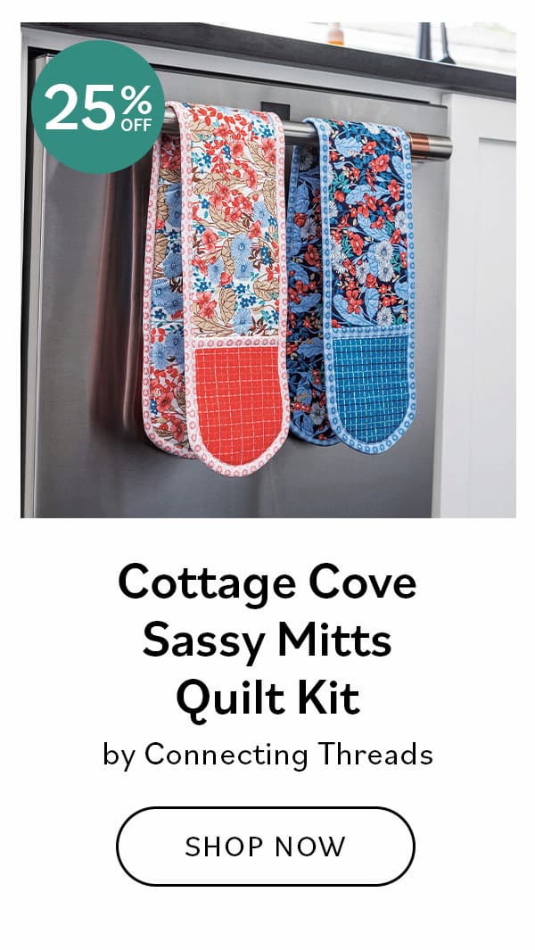 Image: Two oven mitts hanging on a stove handle. Text: Cottage Cove Sassy Mitts Quilt Kit by Connecting Threads. Shop Now >>