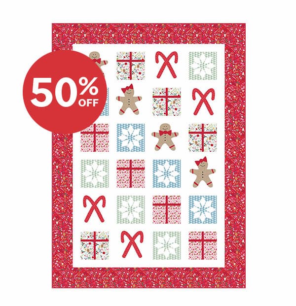 Image: The Gingerbread Snowflakes Quilt kit with various holiday themed blocks. Text: 50% off >>