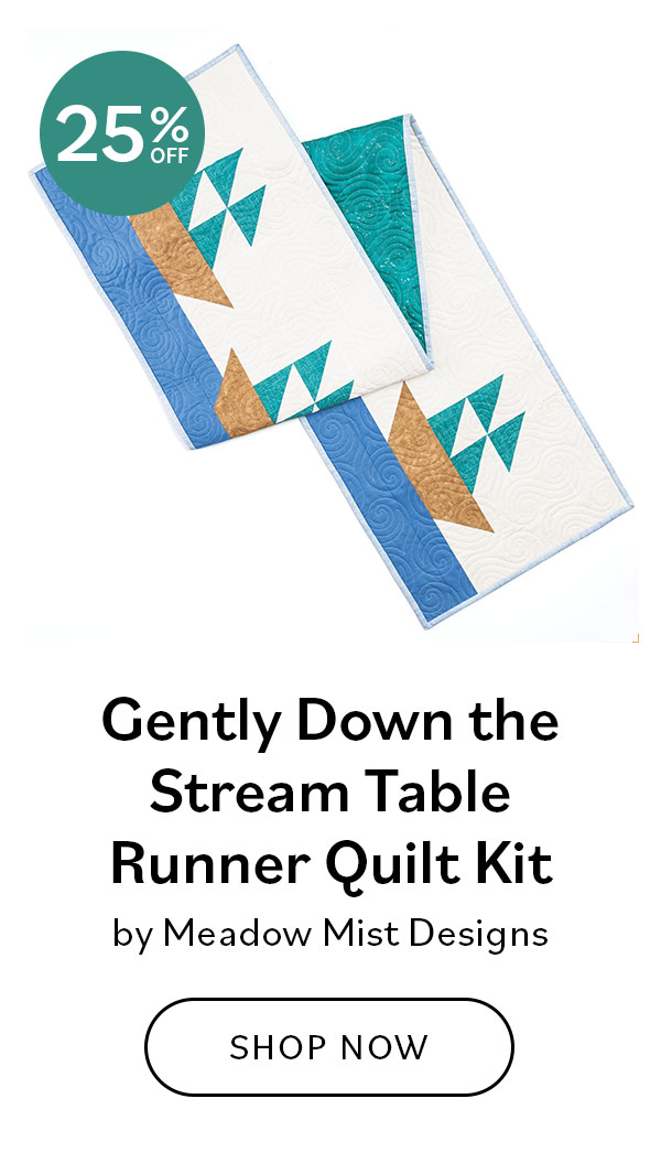 Image: A table runner with sailboat blocks. Text: Gently Down the Stream Table Runner Quilt Kit by Meadow Mist Designs. Shop Now >>