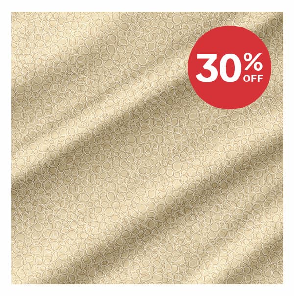 Image: Quilting cotton fabric with cream and tan pebbled pattern. Text: 30% Off >>