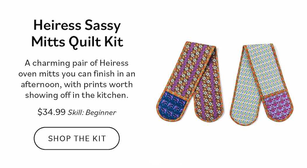Image: A pair of oven mitts in the Heiress collection. Text: Heiress Sassy Mitts Quilt Kit. A charming pair of Heiress oven mitts you can finish in an afternoon, with prints worth showing off in the kitchen. $34.99. Skill: Beginner. Shop the Kit >>