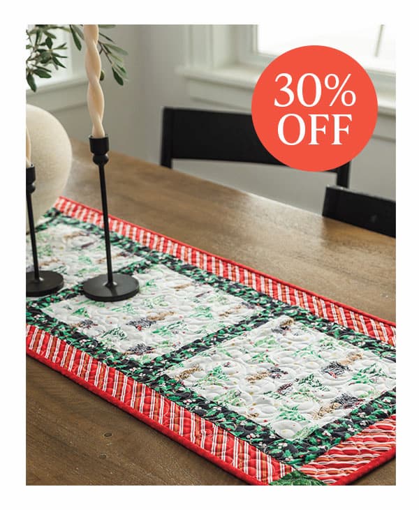 Image: A holiday quilted table runner. Text: 30% off >>