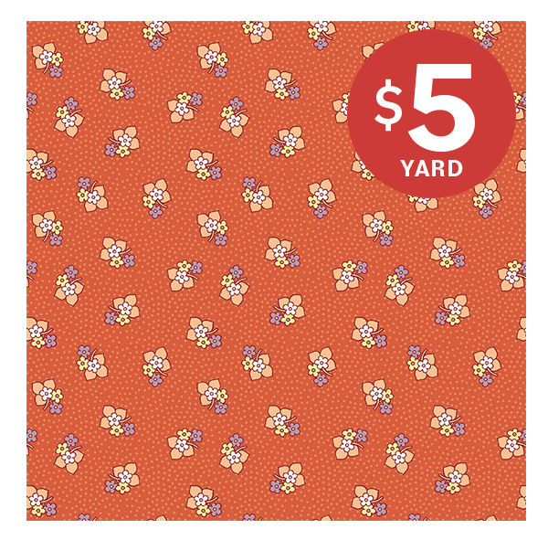 Image: Dark coral colored floral quilting cotton. Text: $5 yard >>