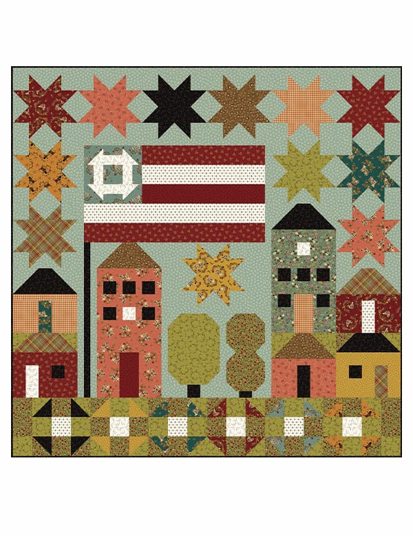 A handmade quilt featuring stars, the american flag, and houses in its design