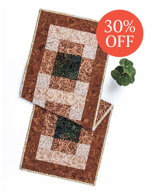 Image: A brown and green table runner. Text: 30% Off >>
