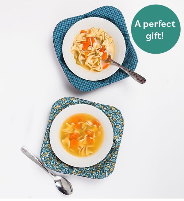 Cozy knitted bowl with plates of food in them