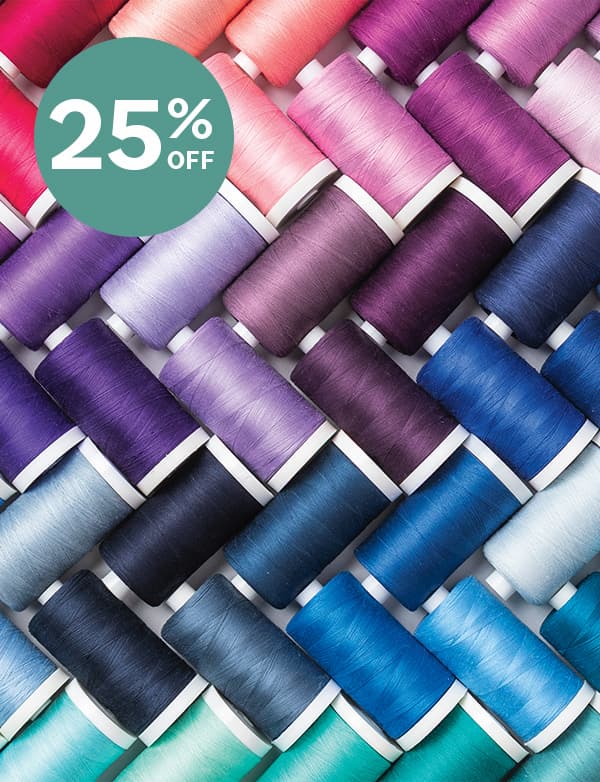 25% Off. A colorful collection of spools of thread.