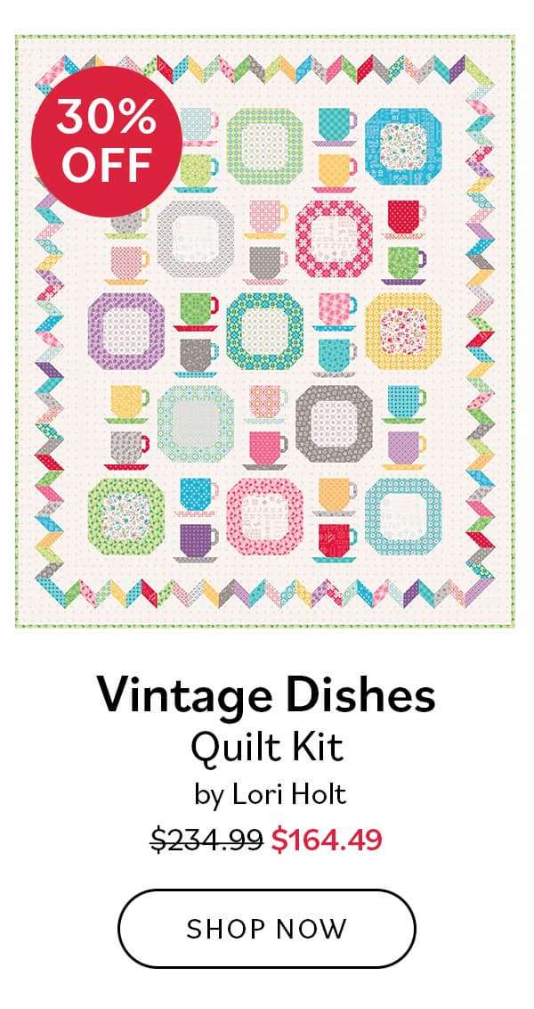 Image: A quilt featuring teacups and dishes. Text: 30% off. Vintage Dishes Quilt Kit by Lori Holt. Was $234.99, now $164.49. Shop Now >>