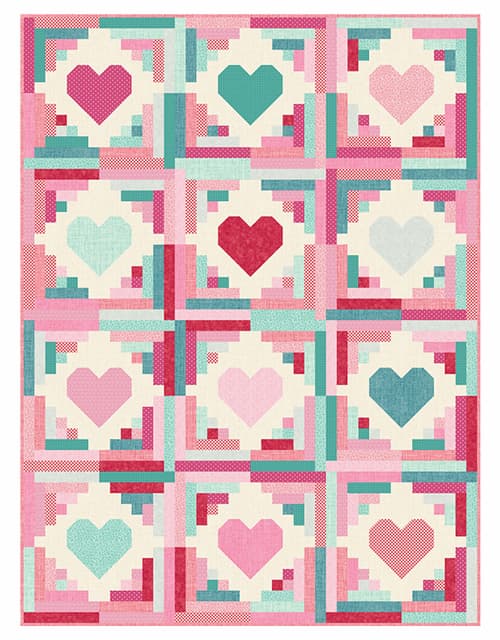 A handmade quilt with red, pink, and blue hearts