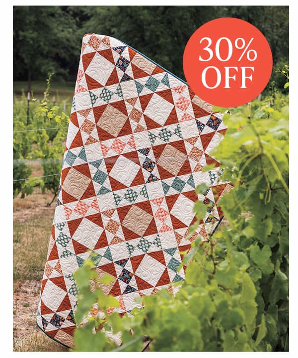 Image: A red, teal, and white quilt. Text: 30% Off >>