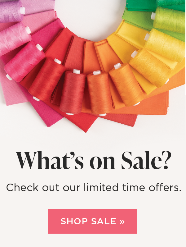 Image: Bright colored spools of thread atop matching fabrics. Text: What's on sale? Check out our limited time offers. Shop Now >>
