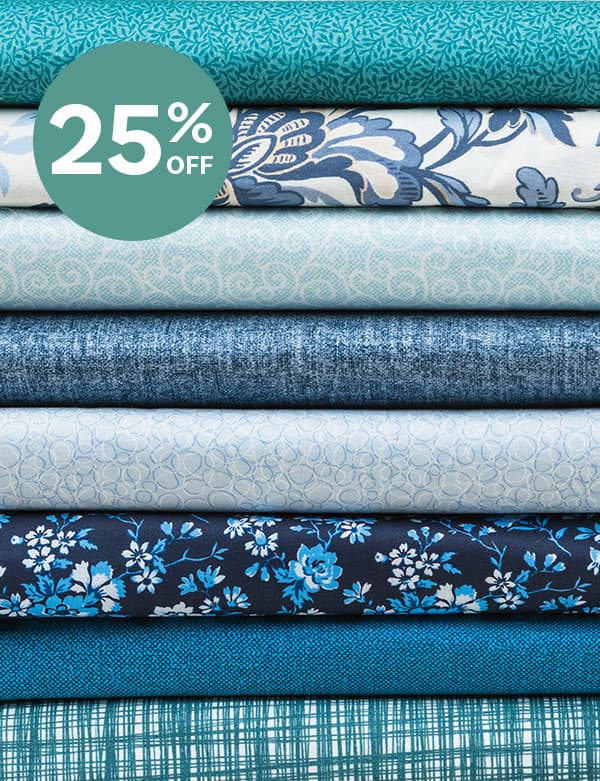 A stack of various blue fabrics. >>