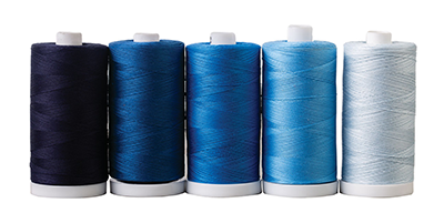 A set of thread cones in different shades of blue >>