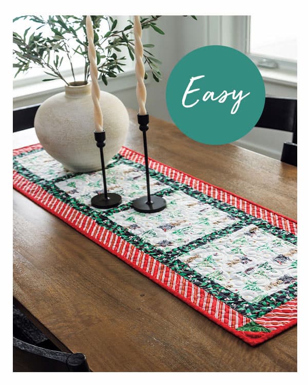Easy. A handmade quilted table runner that is Christmas themed