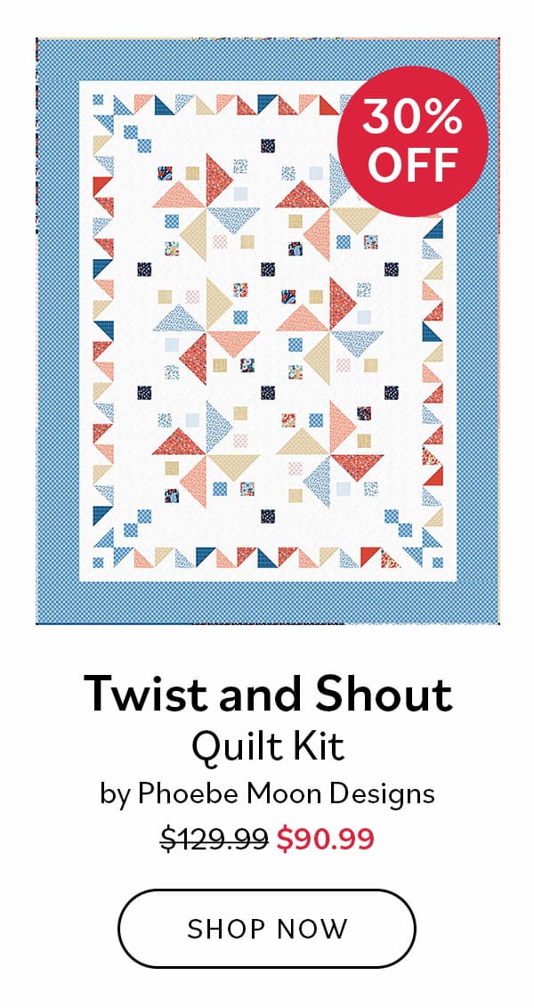 Image: A quilt with white background, blue border, and colorful pinwheel blocks. Text: 30% off. Twisy and Shout Quilt Kit by Phoebe Moon Designs. Was $129.99, now $90.99 >>