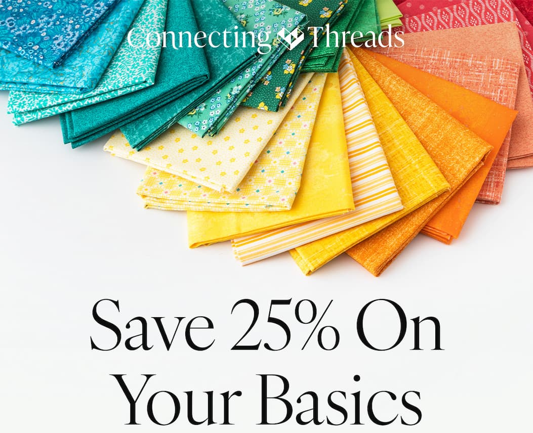 Save 25% On Your Basics. A background image of swatches of colorful patterned fabric