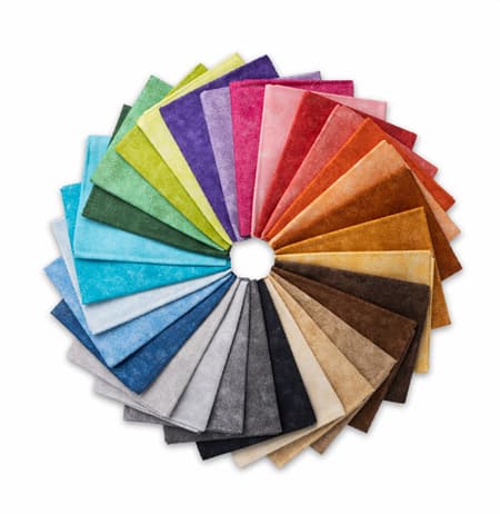 A collection of colorful precut fabrics