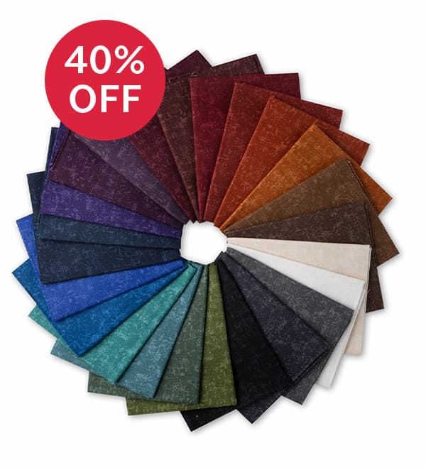Image: A rosette of dark moody flannel fabric fat quarters. Text: 40% off >>