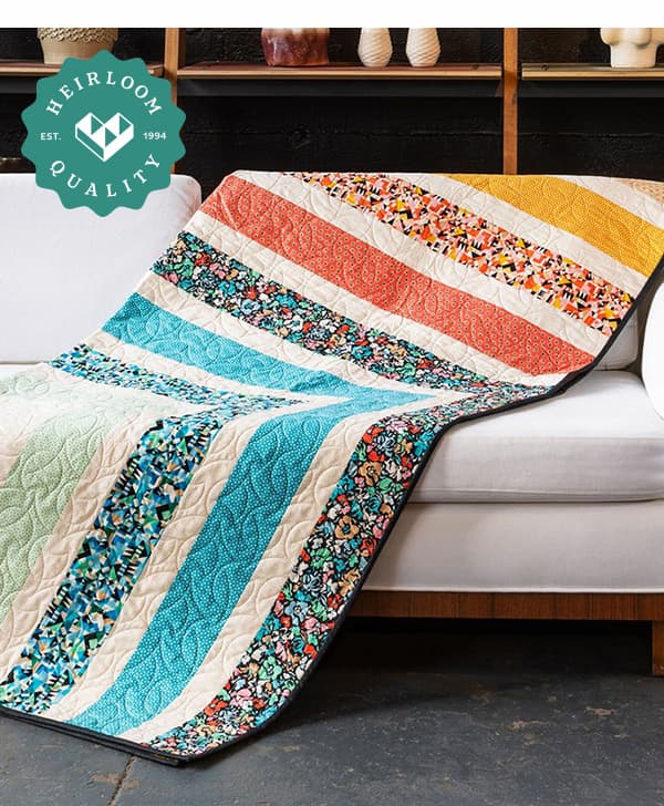 floral and striped quilt on a couch