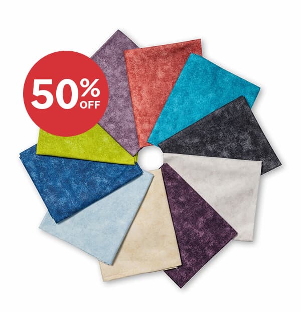  Image: A rosette of folded quilting cotton fat quarters. Text: 50% off >>