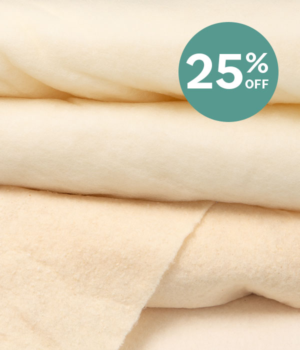 A stack of natural toned quilt batting >>