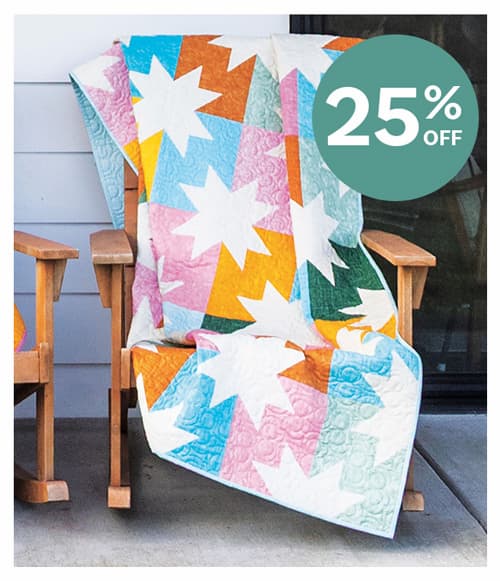 A colorful quilt with white stars >>