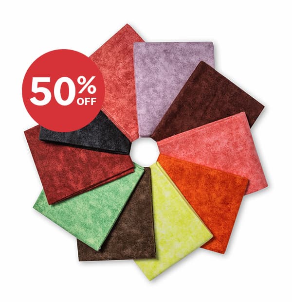  Image: A rosette of tonal fat quarters. Text: 50% off >>